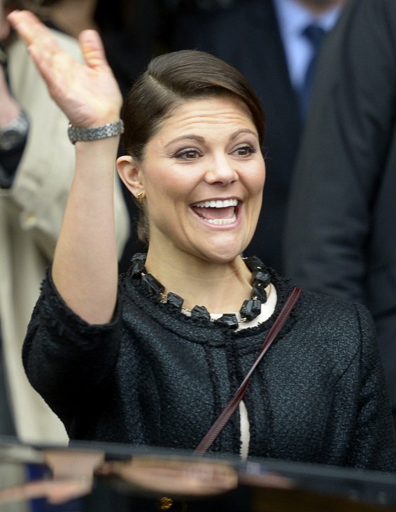 Sweden's Crown Princess Victoria waves to spectators as she and her husband Prince Daniel, the Duke of Vastergotland (not pictured), arrive at the town hall in Hamburg