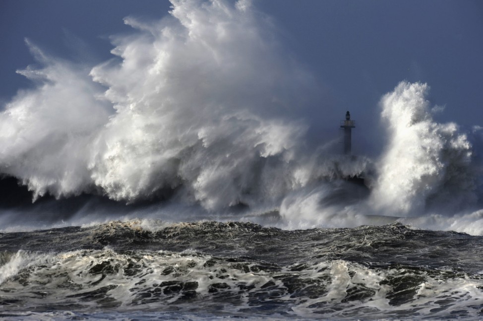 Huge waves crash on the San Esteban de Pravia seafront in the northern Spanish region of Asturias