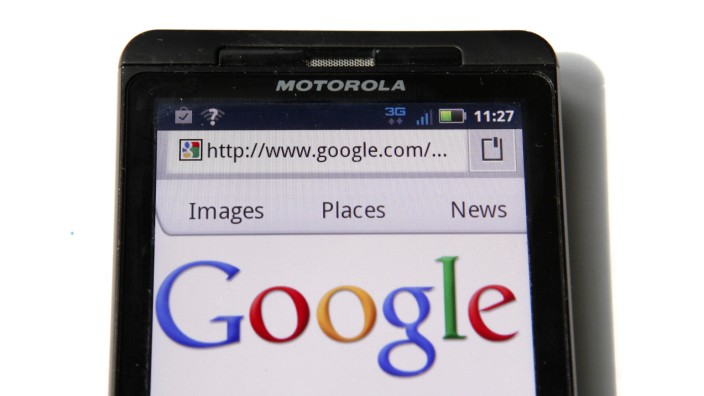 File of a Google homepage is displayed on a Motorola Droid phone in Washington