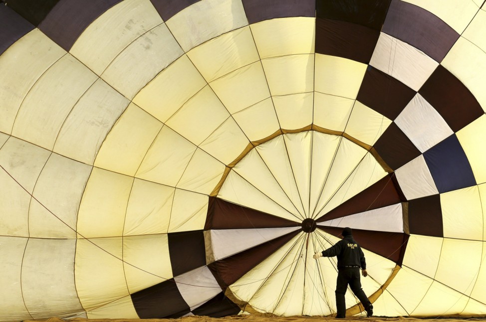 A pilot checks his balloon before the 36th International Hot Air Balloon Week in Chateau-d'Oex