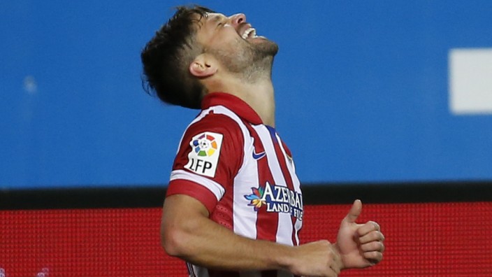 Atletico Madrid's Ribas celebrates his goal against Real Sociedad during their Spanish First Division soccer match at Vicente Calderon stadium in Madrid