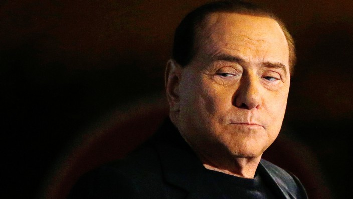 File photo of Italy's former Prime Minister Silvio Berlusconi looking on during a speech from the stage in downtown Rome