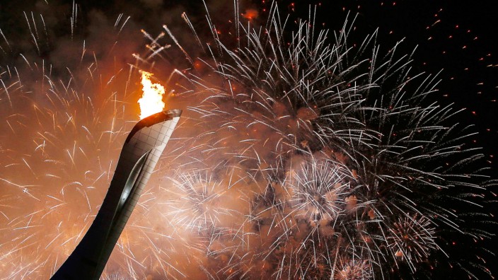 Fireworks explode after the Olympic Cauldron is been lit during the opening ceremony of the 2014 Sochi Winter Olympics