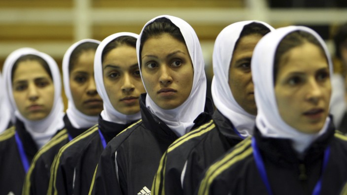Iran's women's soccer team lines up during the opening ceremony of the 5th Amman International Women Soccer Championship in Amman