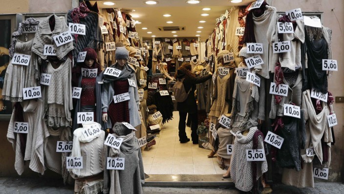 Clothes are seen displayed in a shop in downtown Rome