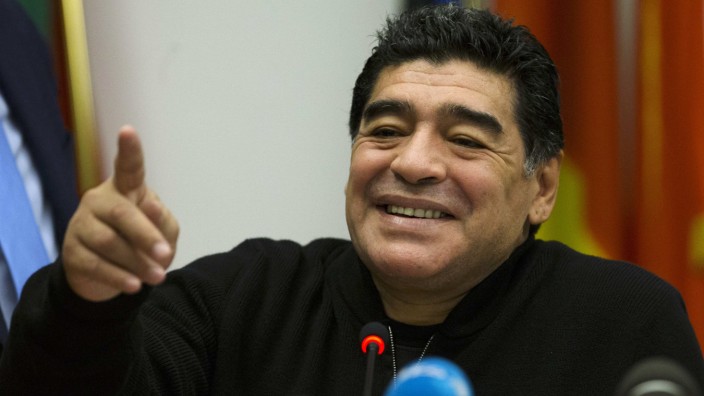 Former Argentine soccer player Maradona attends a news conference in Rome