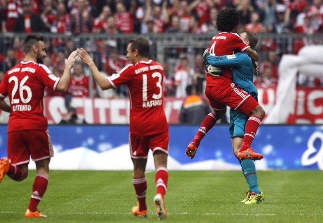 Bayern Munich's Contento, Rafinha, Dante and Neuer celebrate a goal during their German Bundesliga first division soccer match against Freiburg in Munich