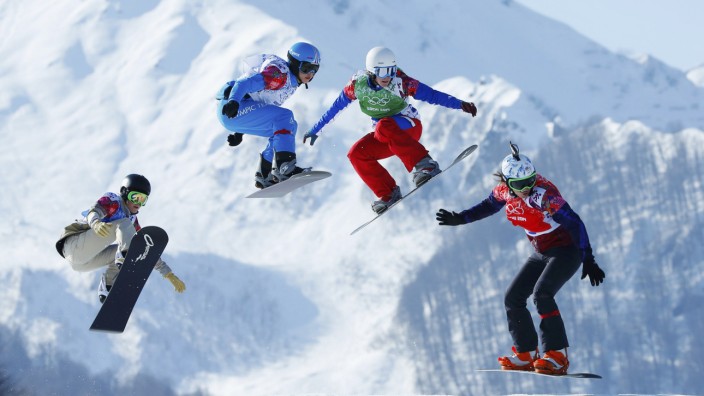 Faye Gulini of U.S., Austria's Maria Ramberger, France's Nelly Moenne Loccoz and Eva Samkova of Czech Republic compete during women's snowboard cross quarter-finals at 2014 Sochi Winter Olympic Games in Rosa Khutor