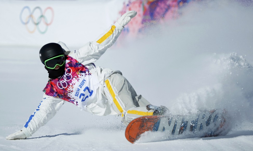 Finland's Merika Enne arrives at the finish line during women's snowboard slopestyle semi-finals event  at the 2014 Sochi Winter Olympics in Rosa Khutor