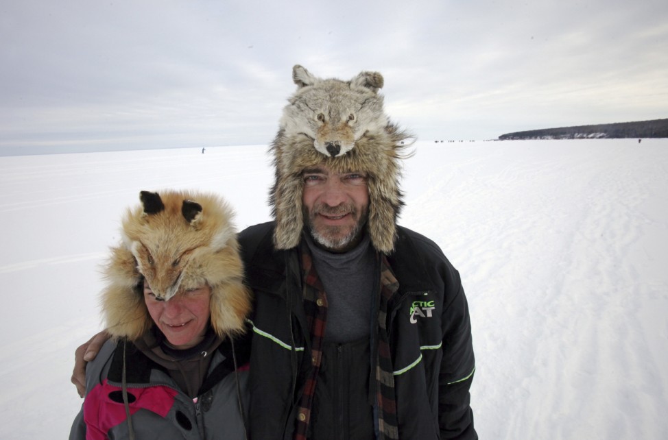 Couple wear warm hats to visit Lake Superior sea caves of the Apostle Islands National Lakeshore