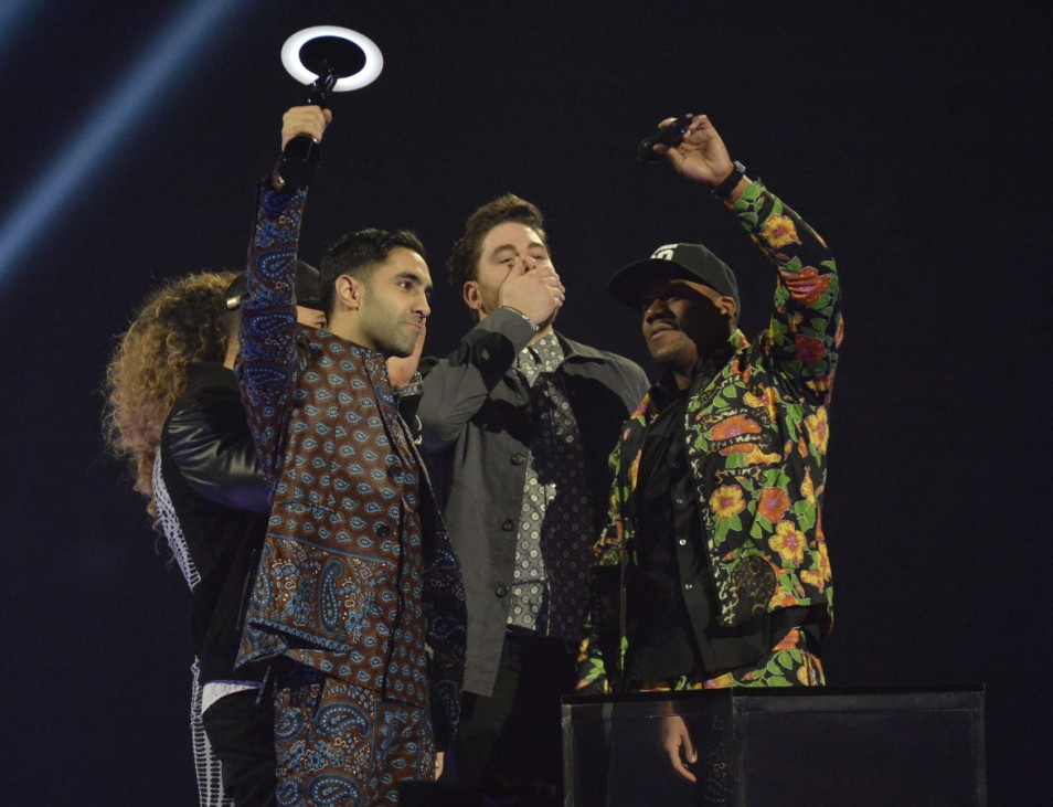 Members of Rudimental react after being presented with the British Single award at the BRIT Awards in London