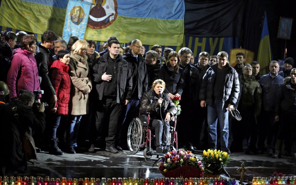 Ukrainian opposition leader Tymoshenko addresses anti-government protesters gathered in the Independence Square as her daughter Yevgenia and opposition leader Yatsenyuk look on in Kiev