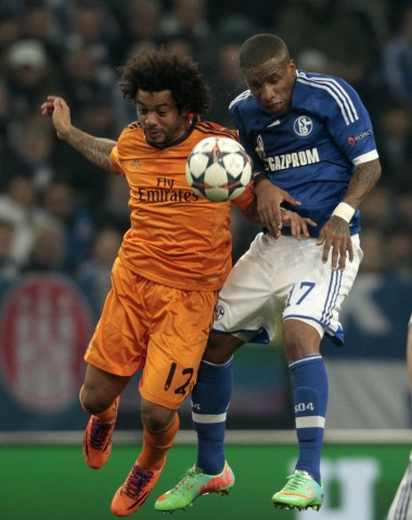 Schalke 04's Farfan and Real Madrid's Marcelo head a ball during their Champions League soccer match in Gelsenkirchen
