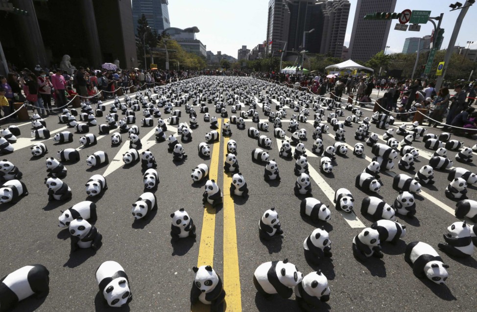 Papier mache pandas, created by French Paolo Grangeon, are seen displayed outside the Taipei City Hall as part of an exhibition called 'Pandas on Tour'