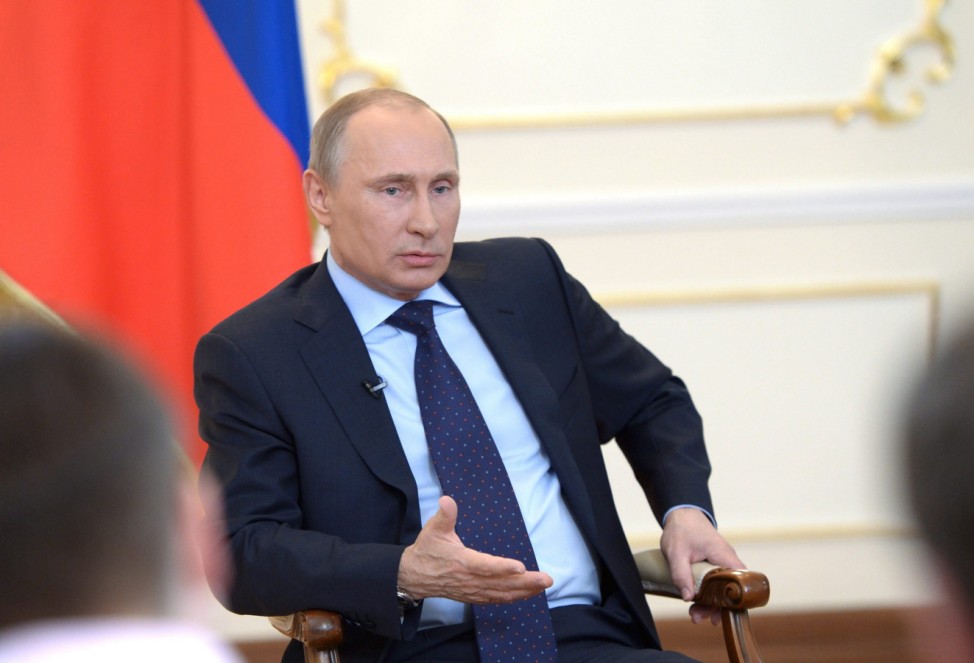 Russian President Vladimir Putin speaks to journalist about the U