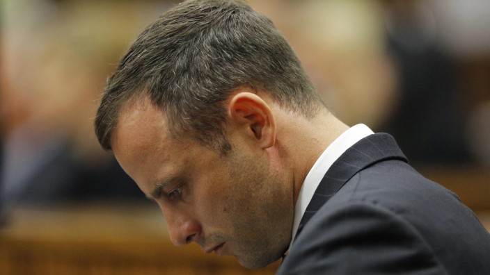 Oscar Pistorius sits in the dock ahead of the second day of the trial of the Olympic and Paralympic track star at the North Gauteng High Court in Pretoria