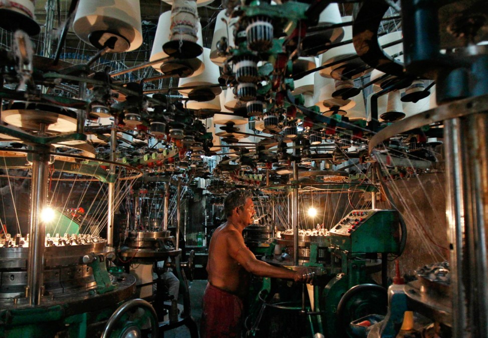 An employee works inside an undergarment factory in Kolkata