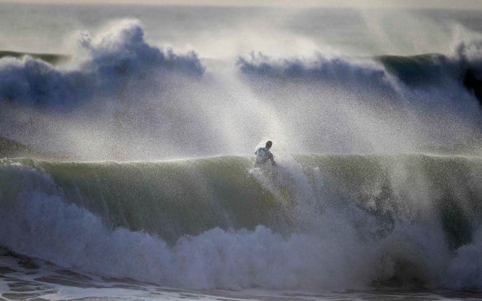 A bodyboarder rides a wave during Sumol Nazare Special Edition in Nazare