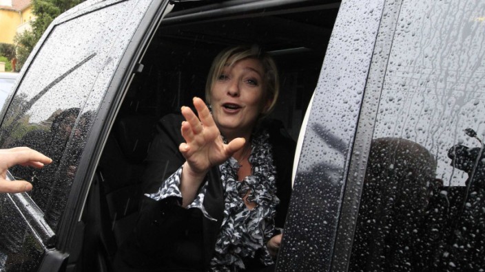 France's far right National Front party leader Le Pen leaves for her party's headquarters in Nanterre