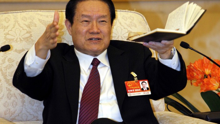 File photo of Chinese former Politburo Standing Committee Member Zhou Yongkang gesturing in Beijing