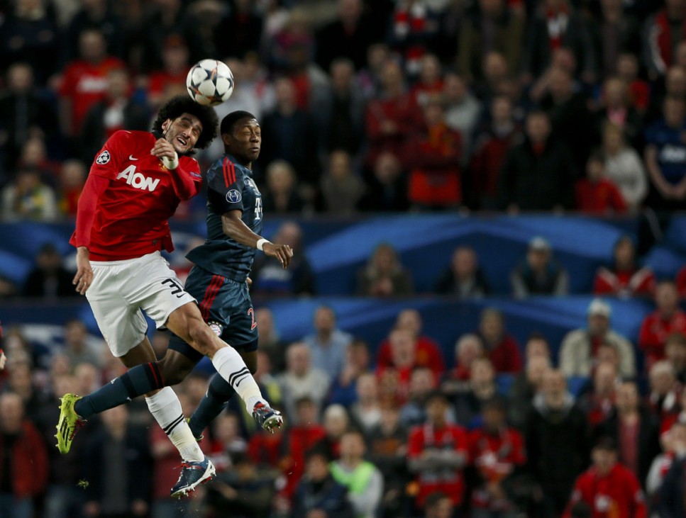 Manchester United's Fellaini goes for a header with Bayern Munich's Alaba during their Champions League quarter-final first leg soccer match at Old Trafford in Manchester