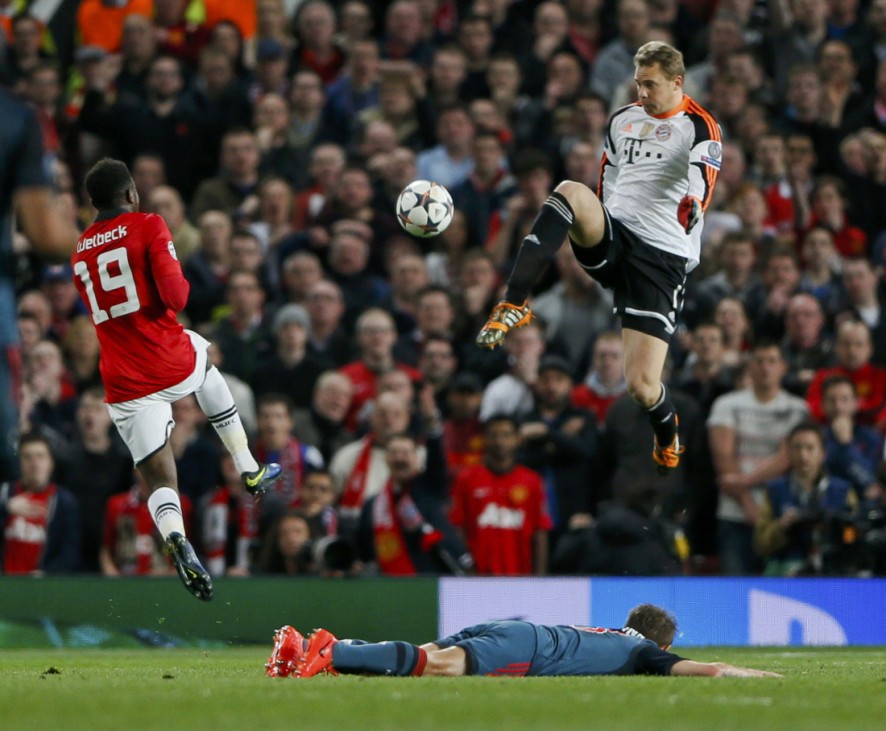 Bayern Munich's Neuer kicks the ball past Manchester United's Welbeck during their Champions League quarter-final first leg soccer match at Old Trafford in Manchester