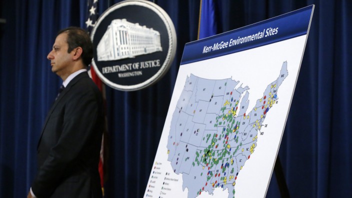 U.S. Attorney for the Southern District of New York Bharara stands beside a map during an announcement of a settlement with Anadarko Petroleum Corp in Washington
