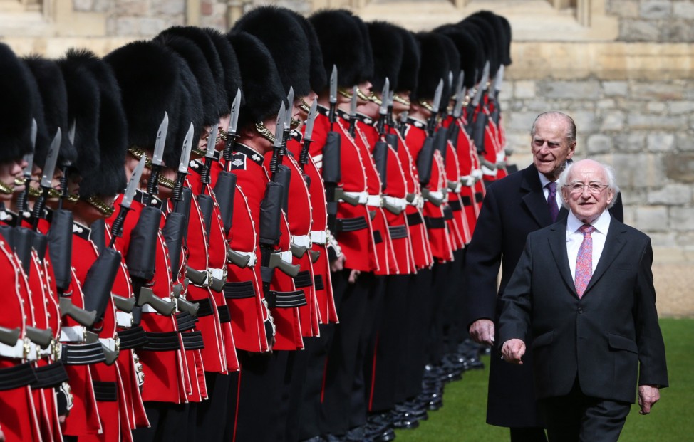 The President of Ireland Michael D. Higgins inspects a Guard of Honour with Britain's with Prince Philip at Windsor Castle in Windsor