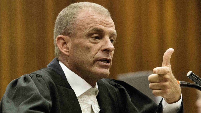 State prosecutor Nel gestures as he cross examines Pistorius during his ongoing murder trial in Pretoria