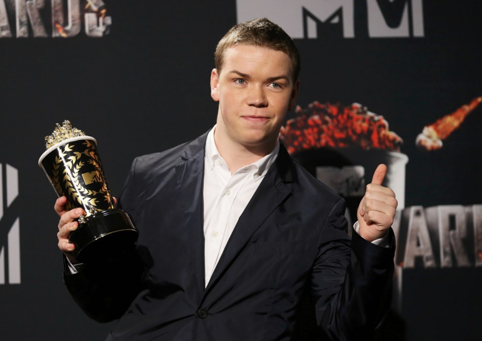 Will Poulter poses backstage with his Best Kiss award during the 2014 MTV Movie Awards in Los Angeles
