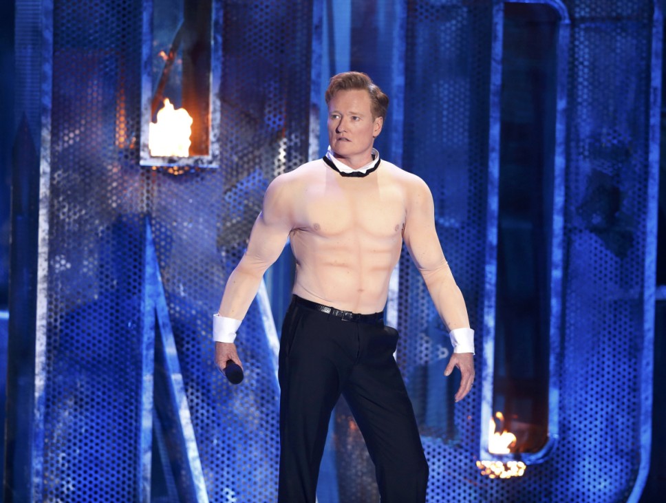 Host Conan O'Brien performs on stage at the 2014 MTV Movie Awards in Los Angeles
