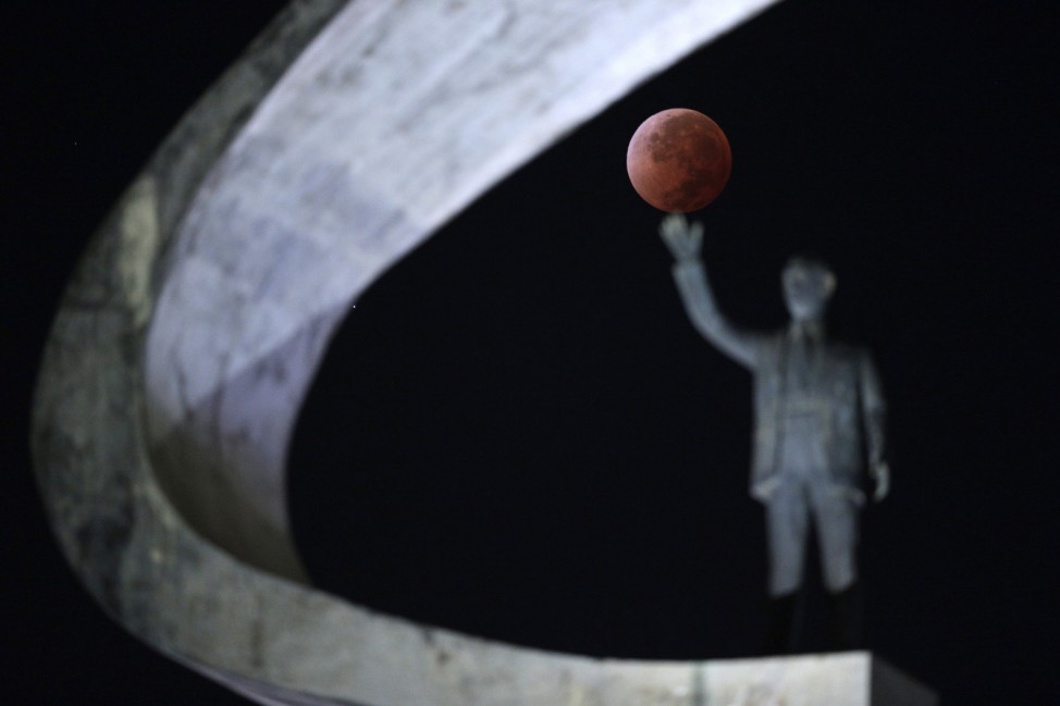 The moon is shown in eclipse in Brasilia