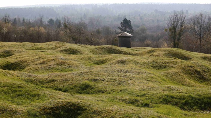 WWI shell craters are seen below the Douaumont cemetery with its Abri 320 a large four shelter French bunker system near Verdun, northeastern France
