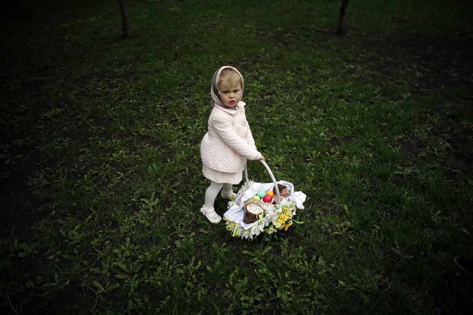 Girl holds basket with Easter eggs in the park in Donetsk, eastern Ukraine