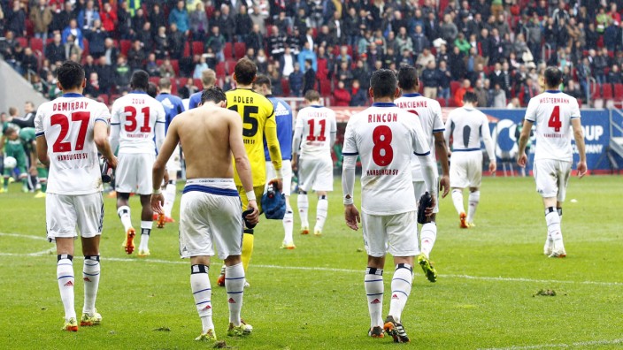 Hamburger SV's players leave the pitch after their German first division Bundesliga soccer match against Augsburg in Augsburg