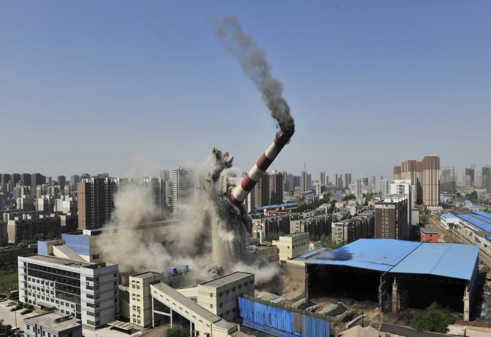 The provincial highest chimney collapses as it is demolished by explosives in Shenyang, Liaoning province