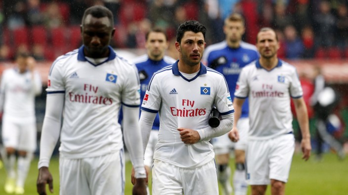 Hamburger SV players react after their German first division Bundesliga soccer match against Augsburg in Augsburg