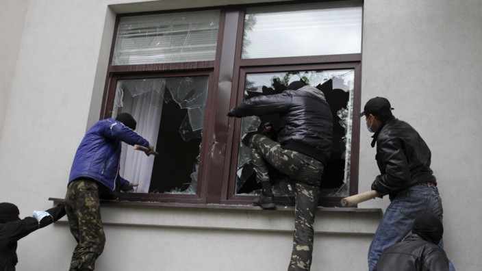 Pro-Russian activists storm the regional government headquarters in Luhansk