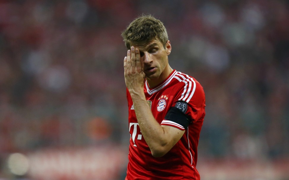 Bayern Munich's Muller wipes his face during the Champions League semi-final second leg soccer match against Real Madrid in Munich