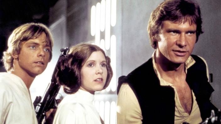 Cast für "Star Wars: Episode VII": Bald wieder für "Star Wars" vereint: Mark Hamill (links), Carrie Fisher und Harrison Ford 1977 im ehemals ersten Teil der "Star Wars"-Filmserie