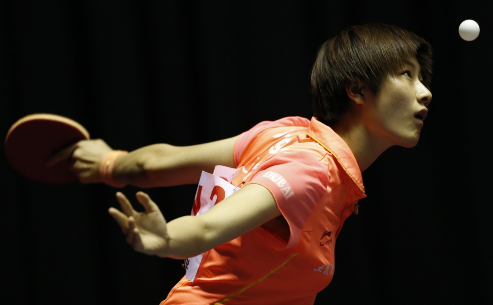 China's Ding eyes the ball as she serves to Slovakia's Odorova during the World Team Table Tennis Championships in Tokyo
