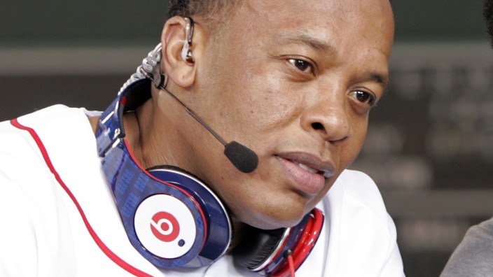 Recording artist Dr. Dre wears a pair of Beats headphones as he attends the 2010 season opener baseball game between the New York Yankees and Boston Red Sox in Boston