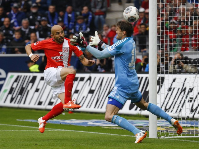 Soto of FSV Mainz 05 scores a goal against goalkeeper Rene Adler during their German first division Bundesliga soccer match in Mainz