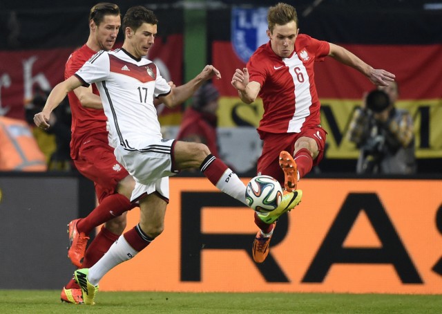 Germany's Goretzka and Poland's Rybus fight for the ball during their friendly soccer match in Hamburg