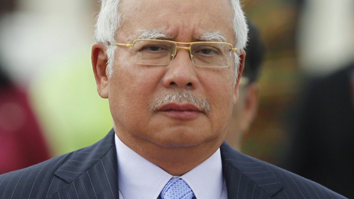 Malaysia's Prime Minister Najib Razak arrives at Naypyitaw international airport to attend the 24th ASEAN Summit