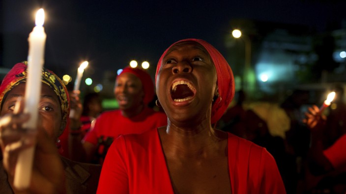 A woman shouts during a vigil in Abuja calling for the release of Nigerian schoolgirls abducted in Chibok