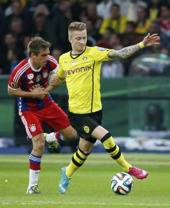 Bayern Munich's Lahm fights for the ball with Borussia Dortmund's Reus during their German Cup (DFB Pokal) final soccer match in Berlin