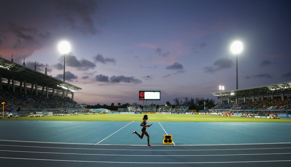 Kenya's Kipyegon runs alone during her leg of Kenya's world record setting win in the women's 4x1500 metres relay, at the IAAF World Relays Championships in Nassau