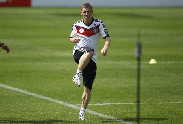 Germany's national soccer player Bastian Schweinsteiger warms up during a training session in St. Leonhard