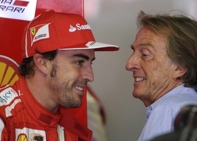 Ferrari Formula One driver Alonso smiles with Ferrari president Montezemolo during the third practice session of the Italian F1 Grand Prix at the Monza circuit